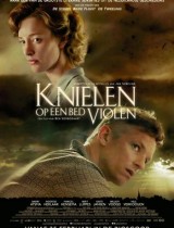 knielen-op-een-bed-violen